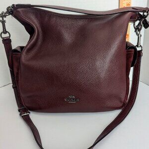slightly used burgundy Coach Pennie shoulder bag